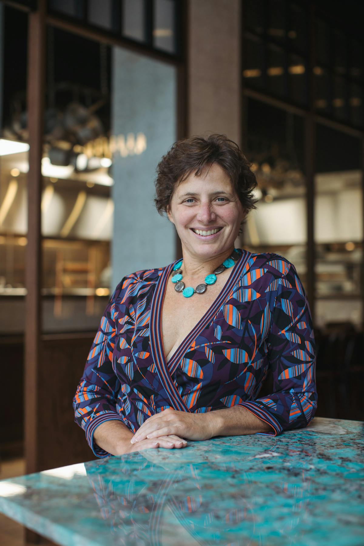 Jill Weber sitting at a table using a laptop